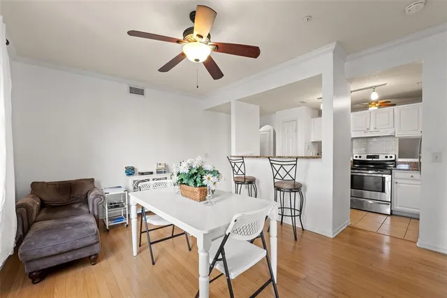 a dining room with furniture and window