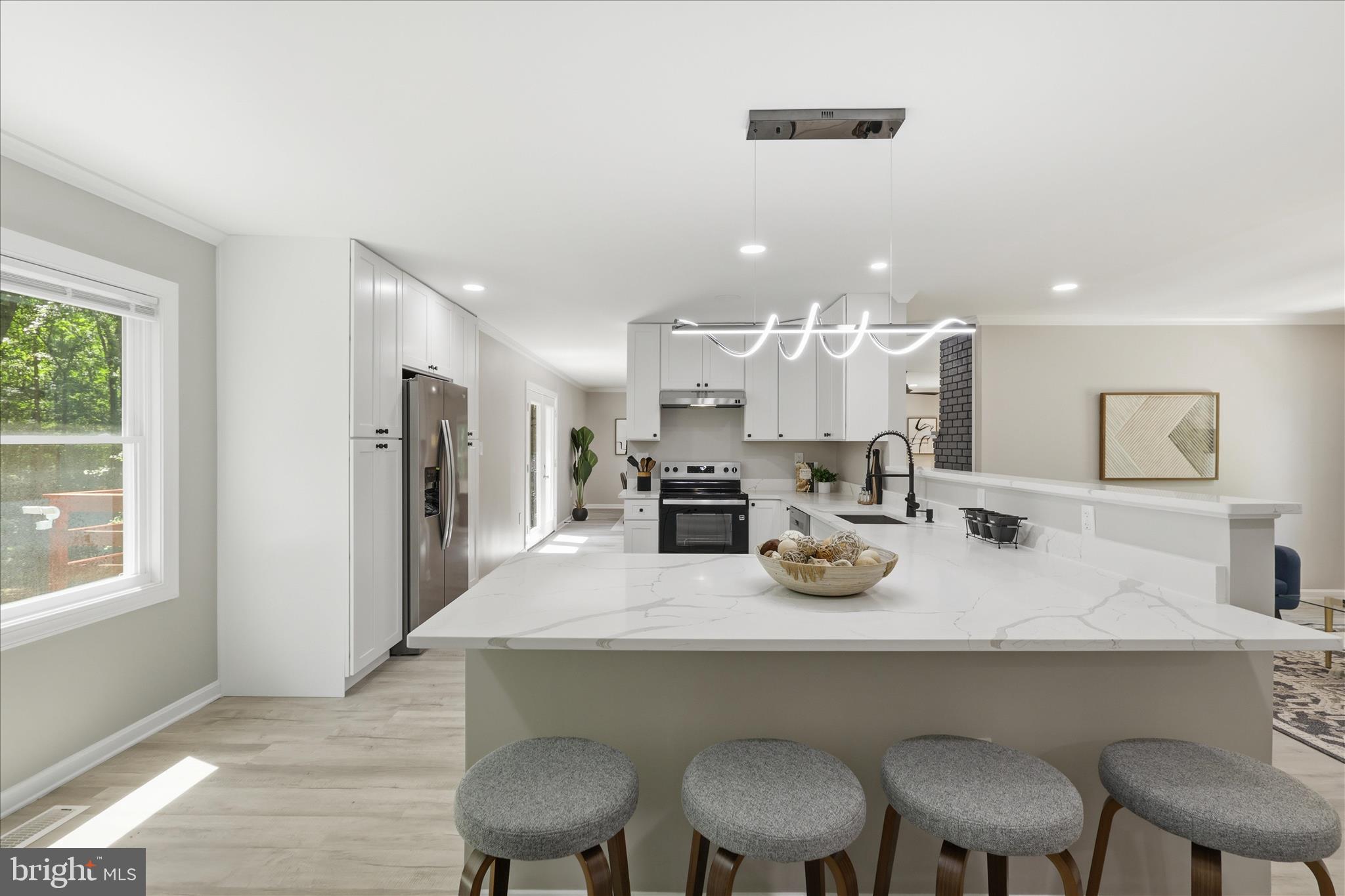 8855 Lowell Road Pomfret, MD 20675 - Photo 7 of 48 Open kitchen with bar seating and dinette area