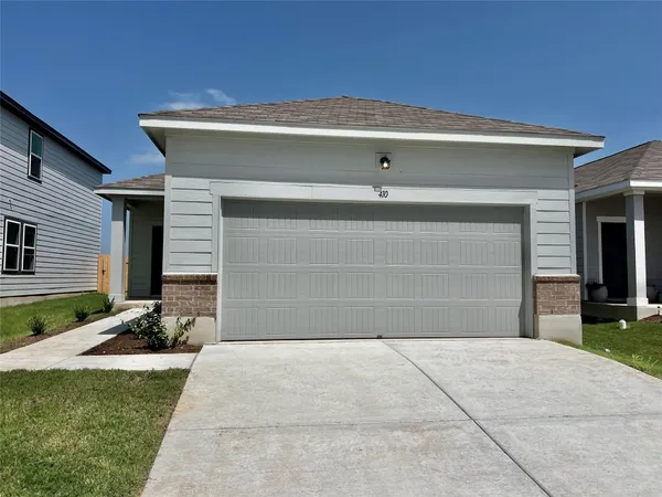 a front view of a house with garage