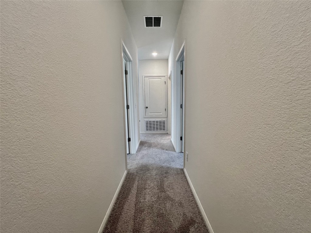 410 Plateau Street Maxwell, TX 78656 - Photo 13 of 14 a view of a hallway