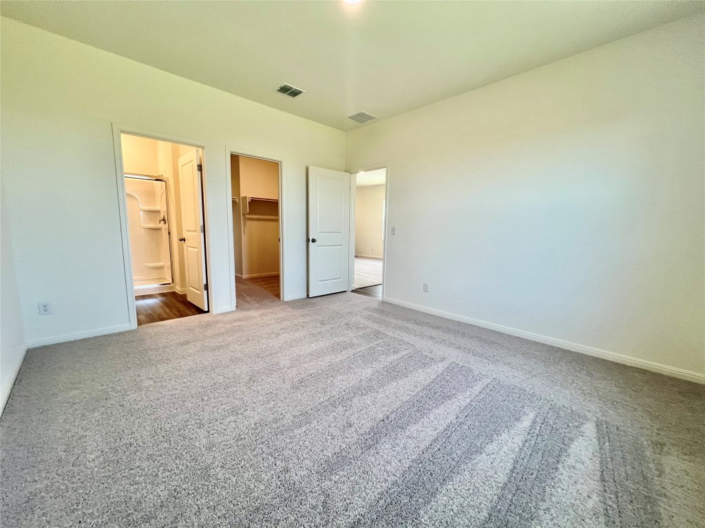 410 Plateau Street Maxwell, TX 78656 - Photo 8 of 14 an empty room with a natural light