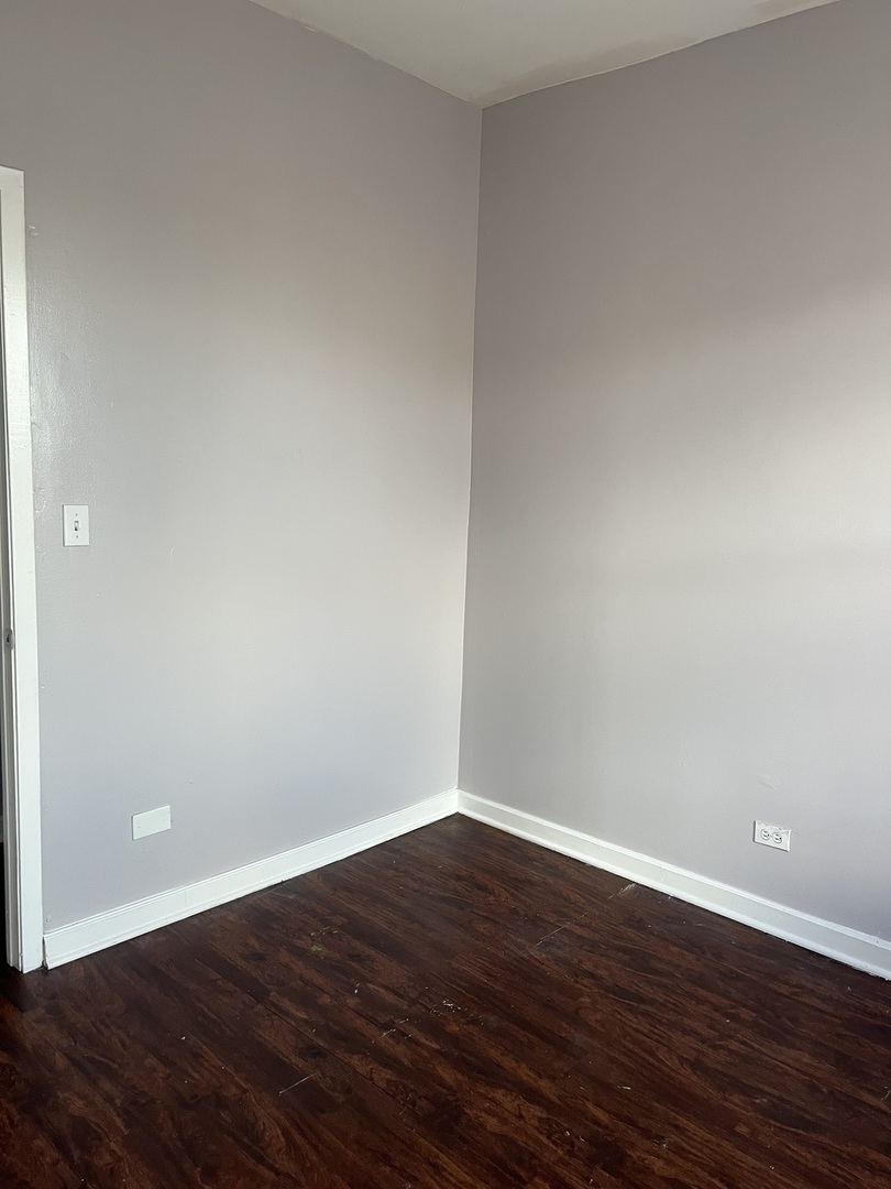 3057 West Flournoy Street, Unit 2 Chicago, IL 60612 - Photo 3 of 13 a view of an empty room with wooden floor