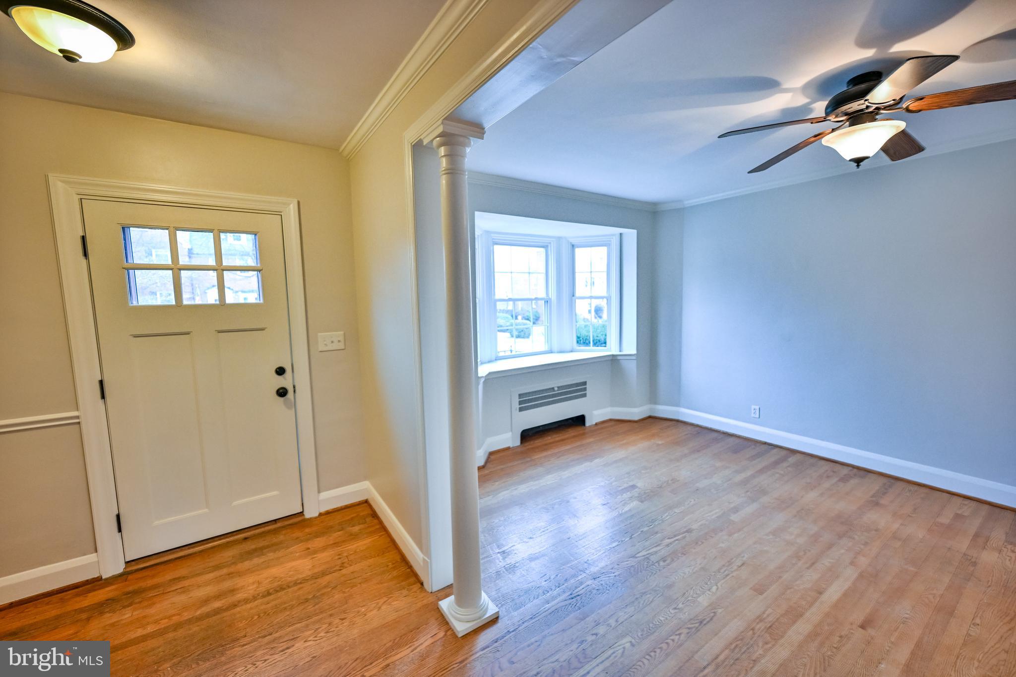 207 Murdock Road Baltimore, MD 21212 - Photo 3 of 45 View from foyer into living room w/ HW floors
