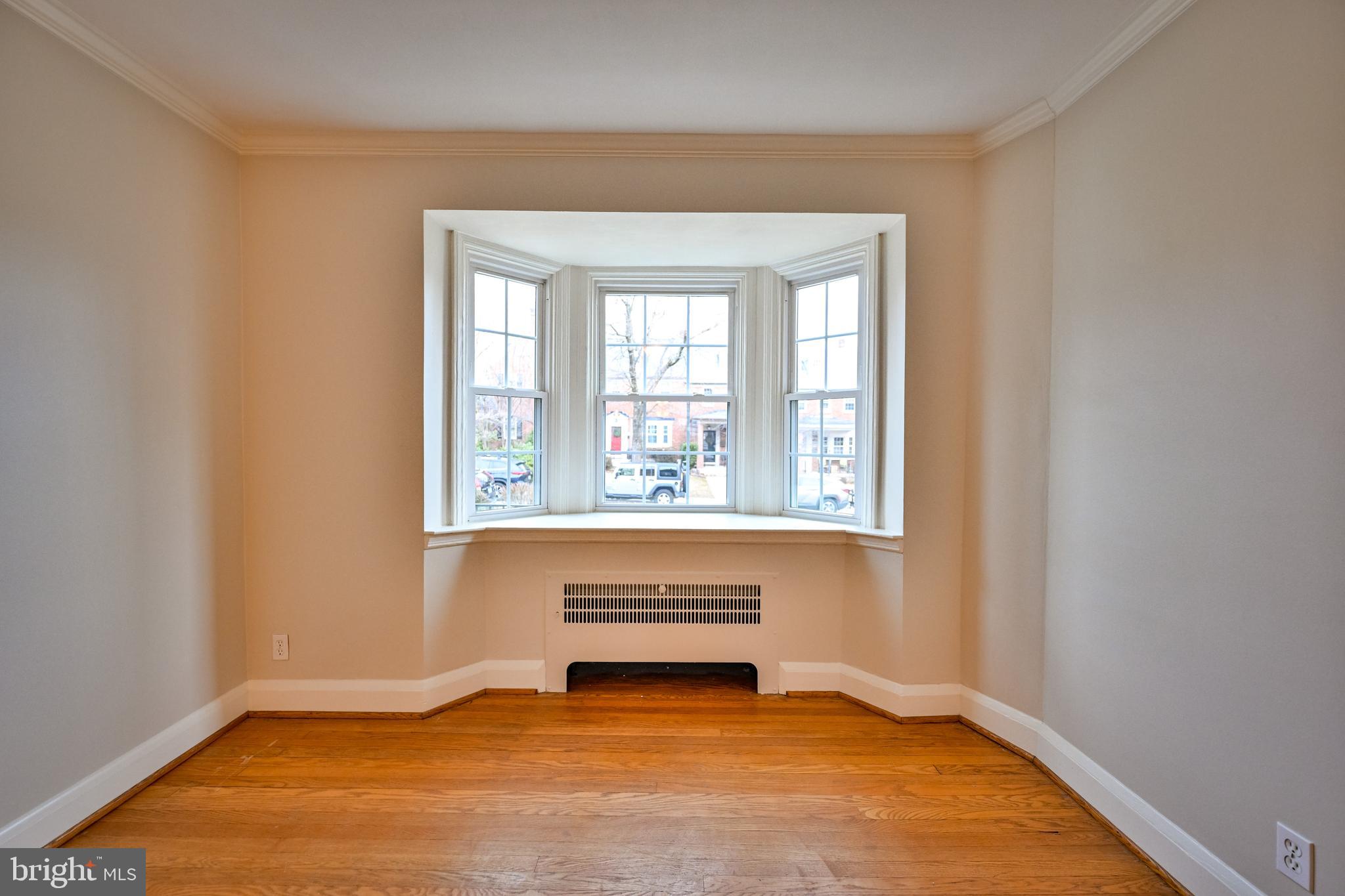 207 Murdock Road Baltimore, MD 21212 - Photo 6 of 45 Living room w/ HW floors and bay window