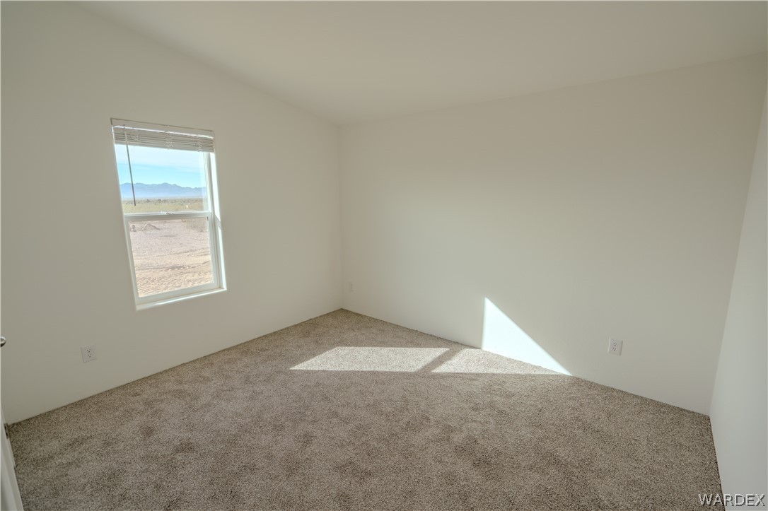 5746 Eden Road Golden Valley, AZ 86413 - Photo 25 of 27 an empty room with a window