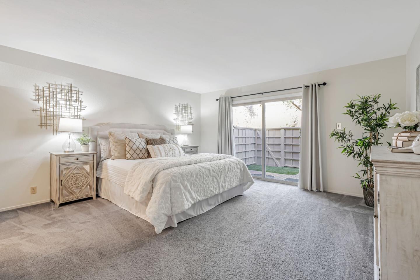 42 Weepingridge Court San Mateo, CA 94402 - Photo 24 of 45 a bedroom with a large bed and a window