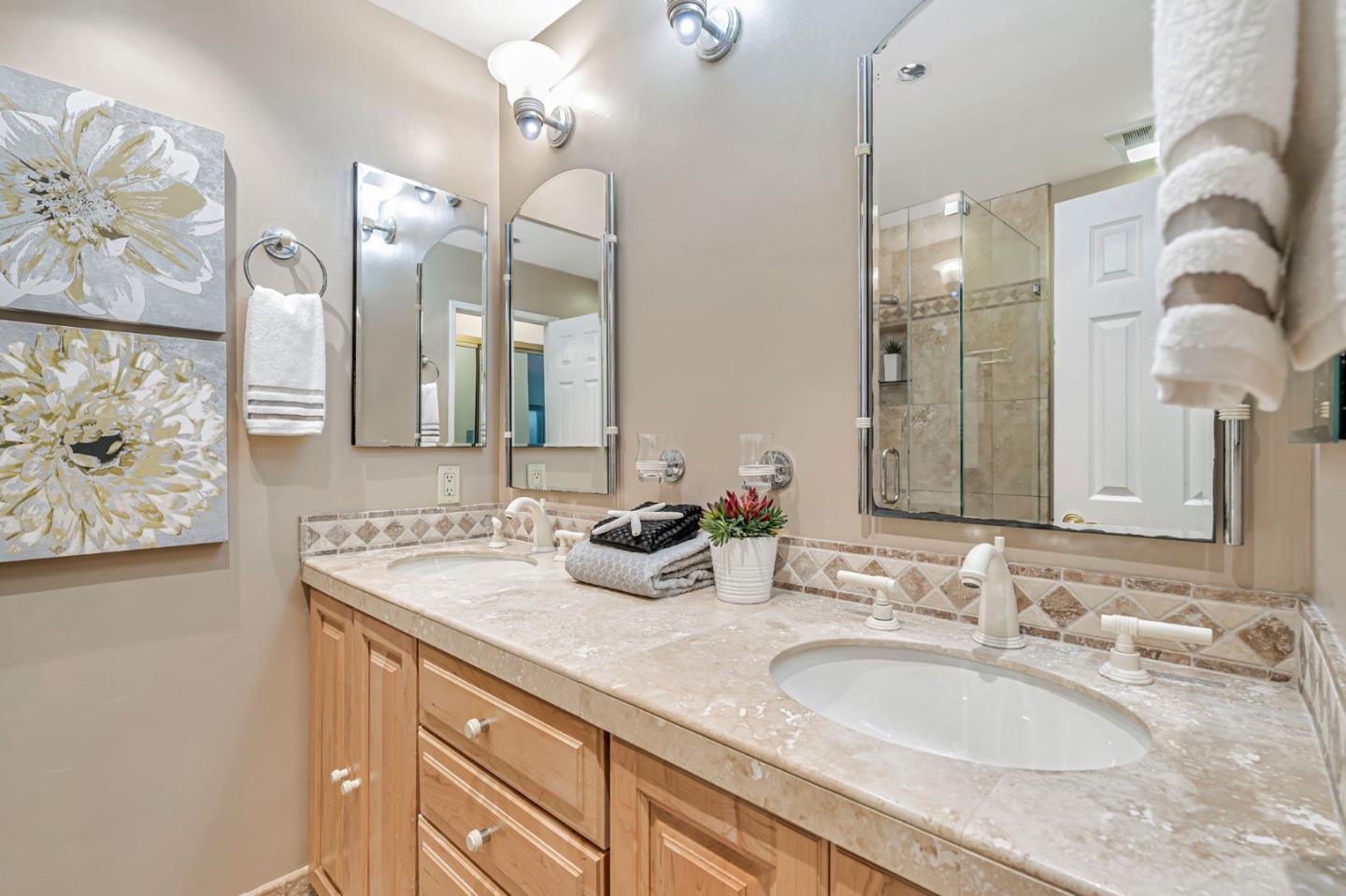 42 Weepingridge Court San Mateo, CA 94402 - Photo 30 of 45 a bathroom with a granite countertop vanity a sink and a mirror