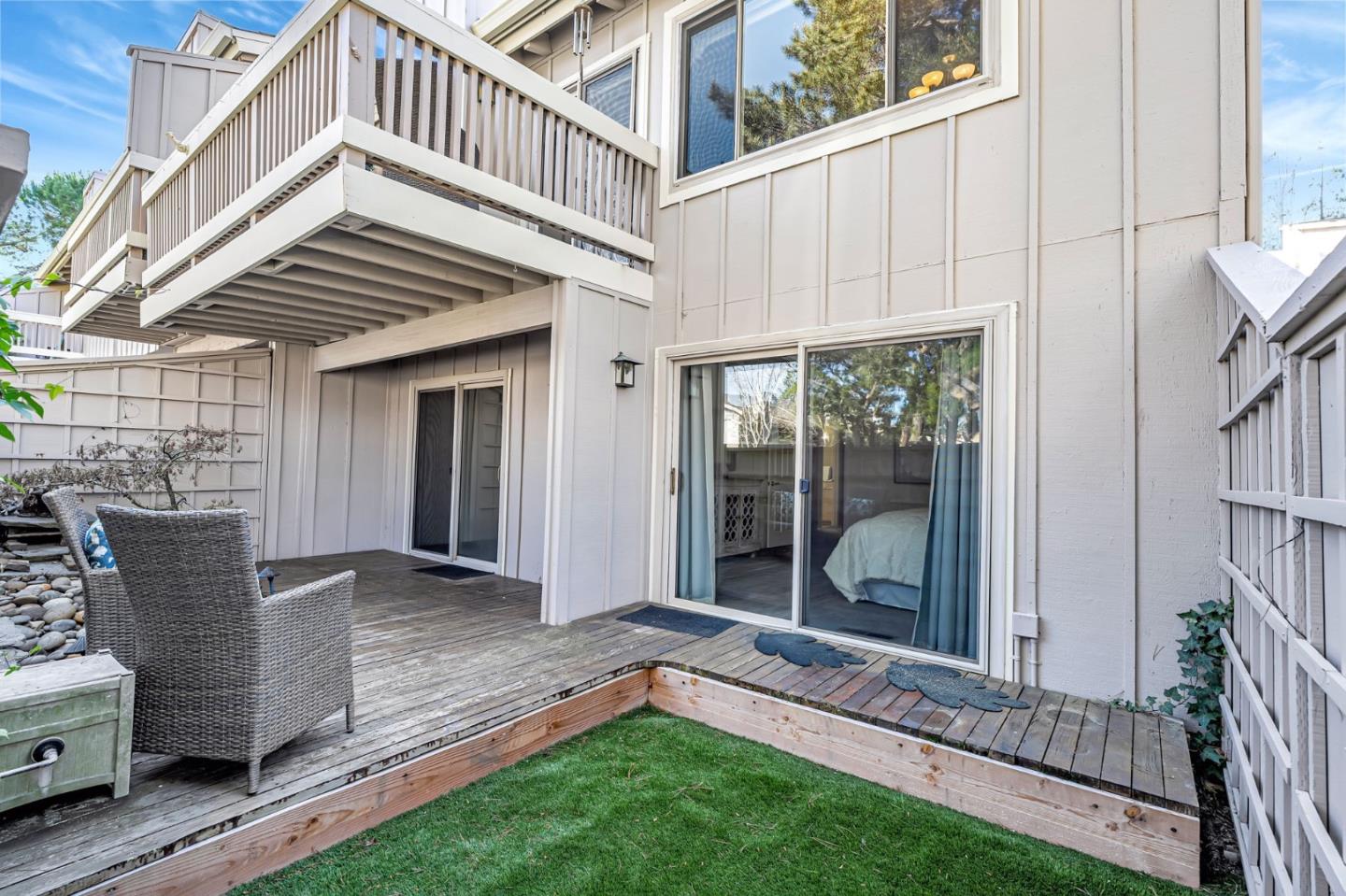 42 Weepingridge Court San Mateo, CA 94402 - Photo 39 of 45 a view of a house with a small yard and wooden floor and fence