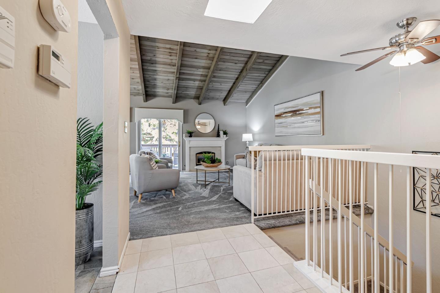 42 Weepingridge Court San Mateo, CA 94402 - Photo 7 of 45 a view of a hallway to a livingroom with furniture