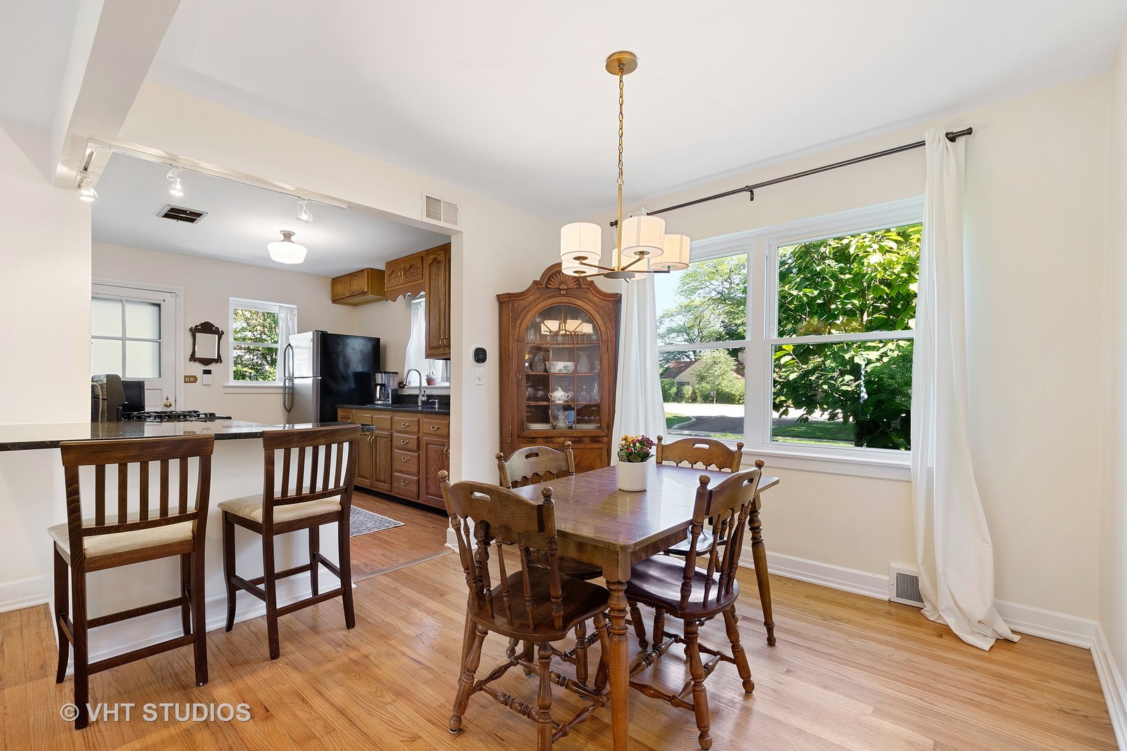 350 Wagner Road Northfield, IL 60093 - Photo 6 of 12 a view of a dining room with furniture window and wooden floor