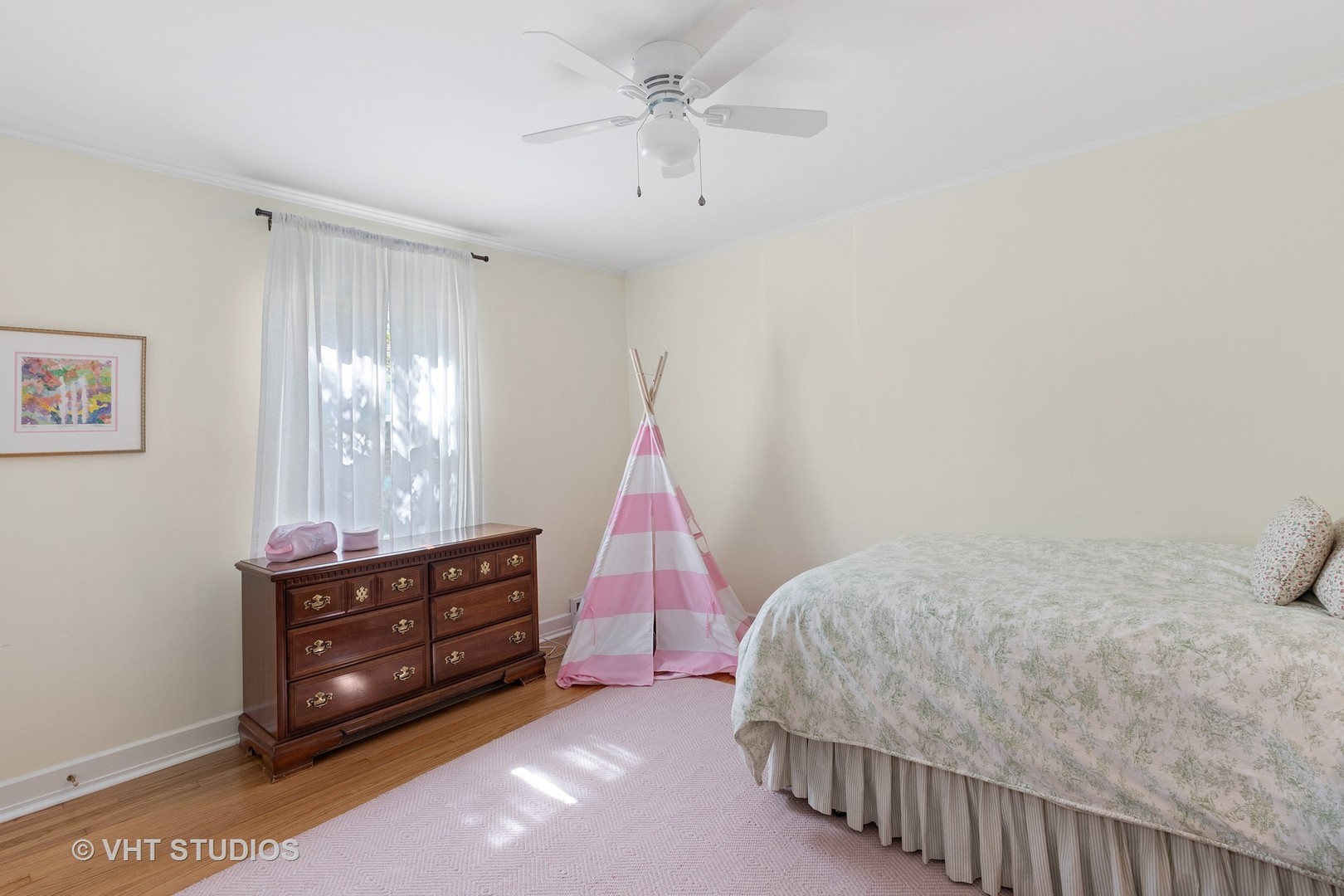 350 Wagner Road Northfield, IL 60093 - Photo 8 of 12 a bedroom with a bed and a chandelier fan