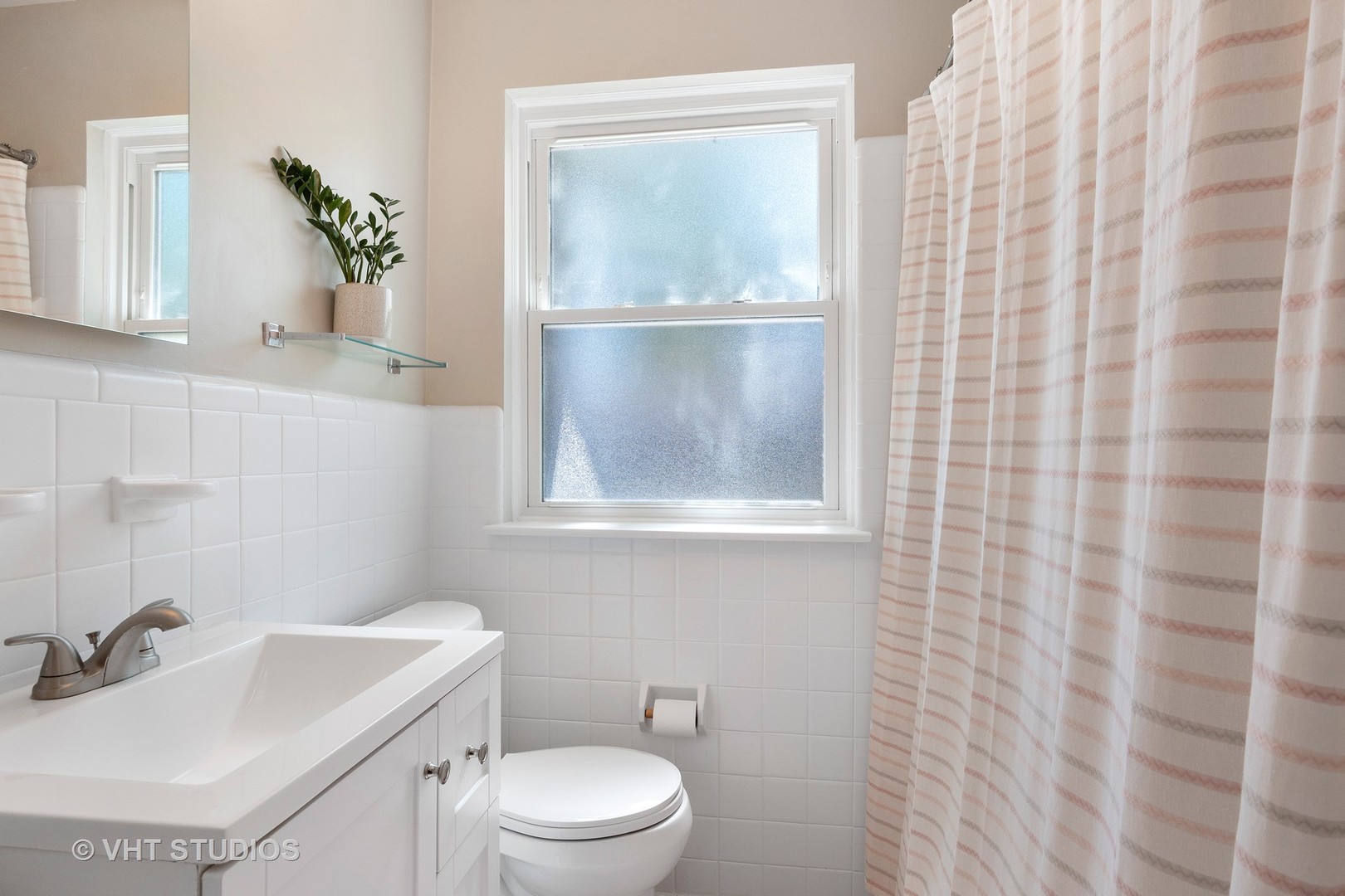 350 Wagner Road Northfield, IL 60093 - Photo 9 of 12 a bathroom with a sink a toilet and shower