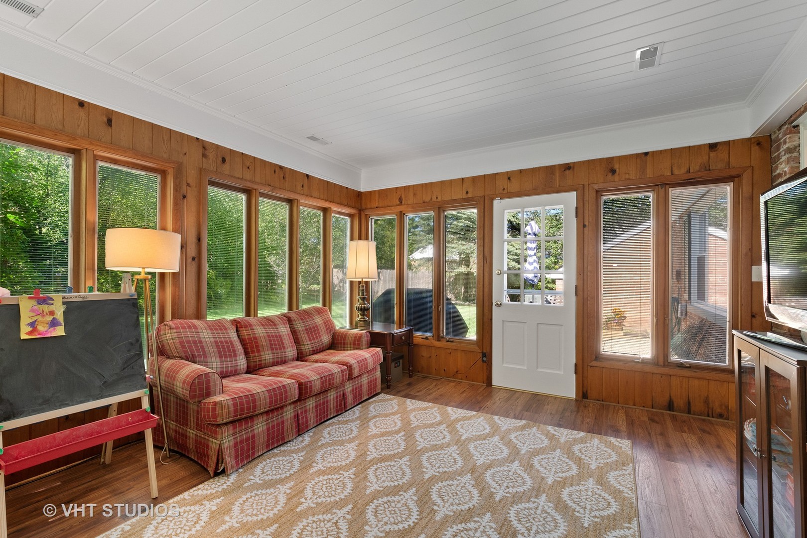 350 Wagner Road Northfield, IL 60093 - Photo 10 of 12 a living room with furniture and a floor to ceiling window