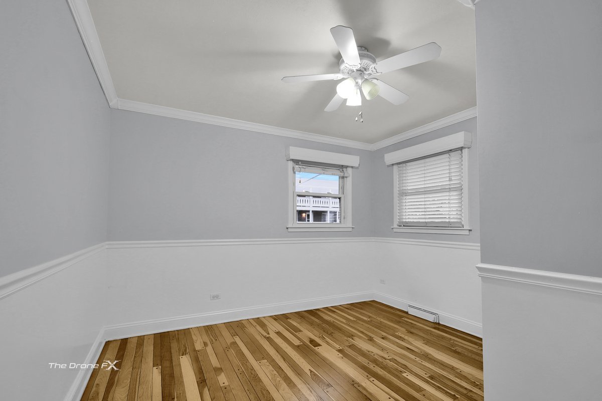 714 Delles Road Wheaton, IL 60189 - Photo 9 of 18 a view of room with window and ceiling fan
