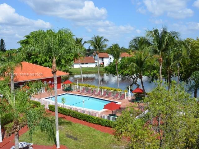 12365 Southwest 18th Street, Unit 403 Miami, FL 33175 - Photo 2 of 4 an aerial view of a house with swimming pool garden and bench