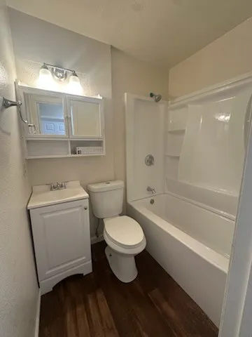 a bathroom with a toilet sink and a bathtub