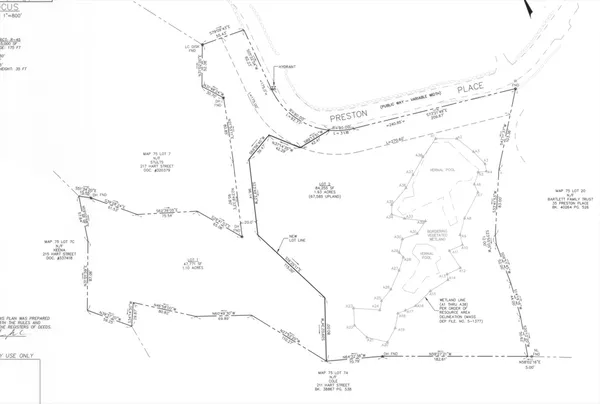 a picture of a room with a white wall and a chair