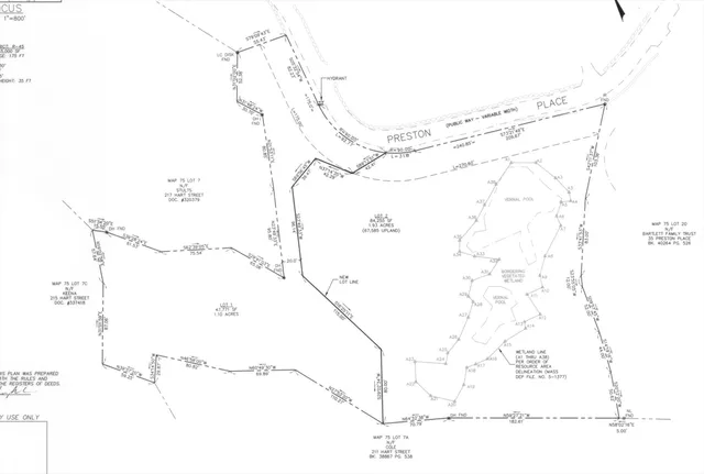 a picture of a room with a white wall and a chair