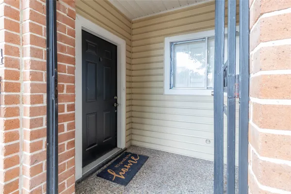 a view of a door and a window