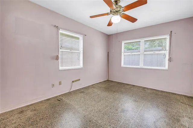 a view of an empty room with a window