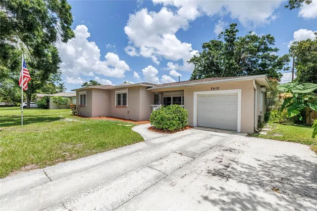 a view of a house with a garden