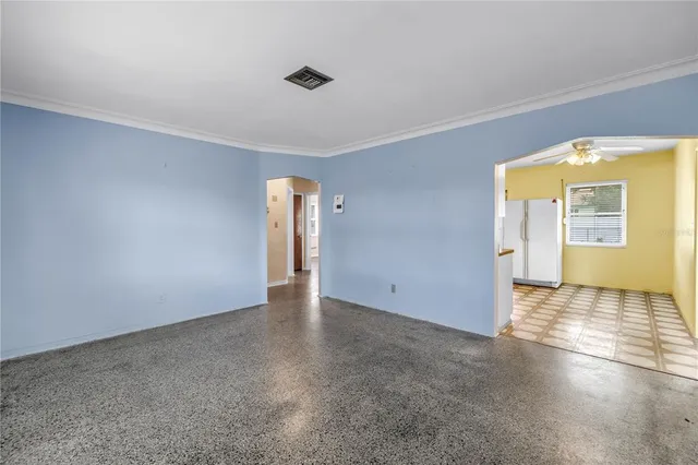 a view of an empty room with a window