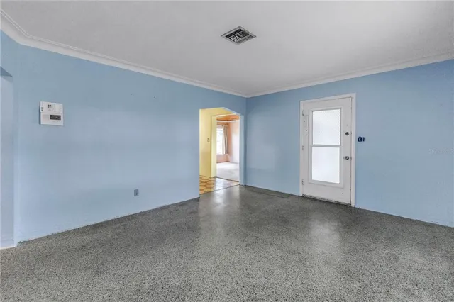 a view of empty room with windows