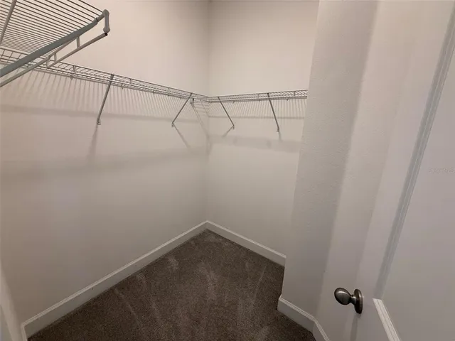 a view of a room with racks on the wall