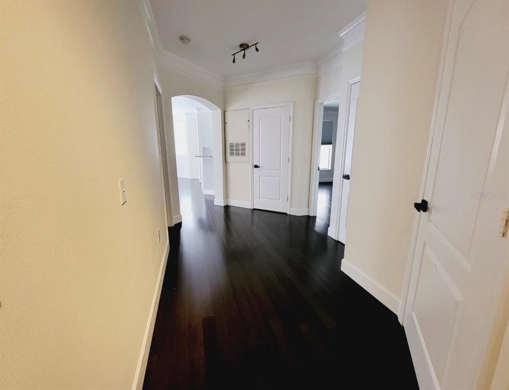 8843 Villa View Circle, Unit 207 Orlando, FL 32821 - Photo 12 of 36 a view of a hallway with wooden floor