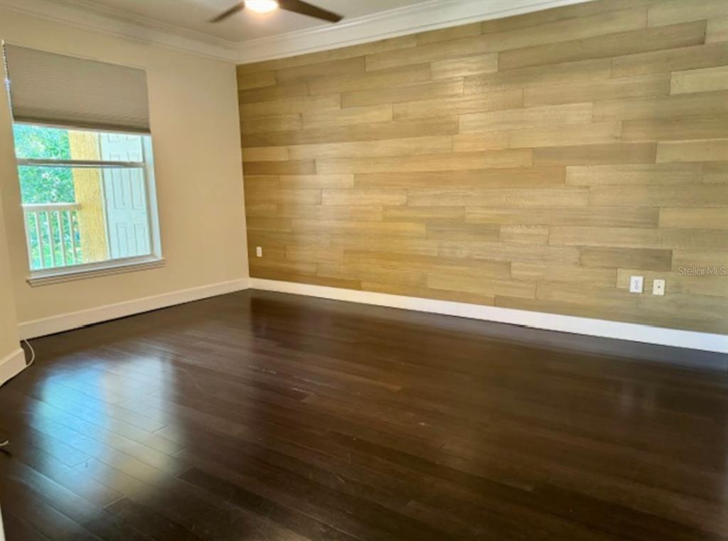 8843 Villa View Circle, Unit 207 Orlando, FL 32821 - Photo 14 of 36 wooden floor in an empty room with a window