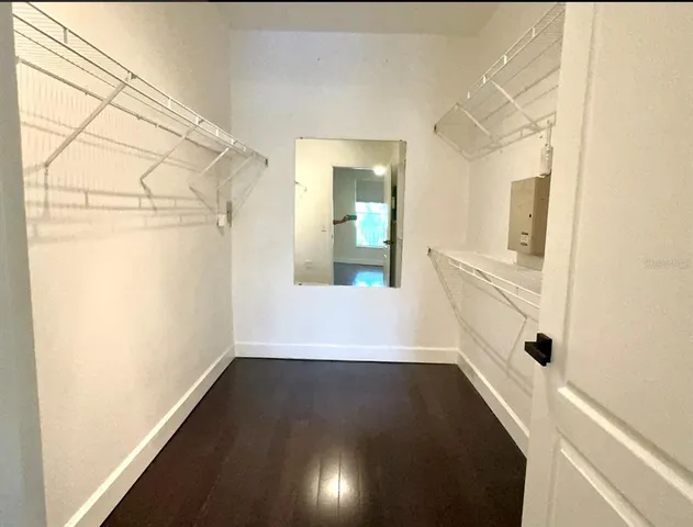 a bathroom with a sink a shower and a mirror