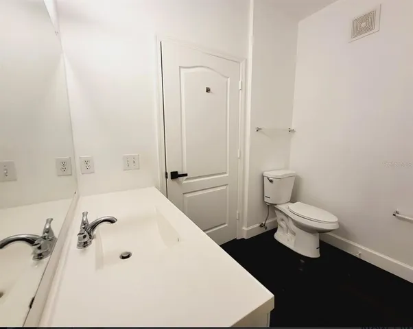 a view of a tree in a yard