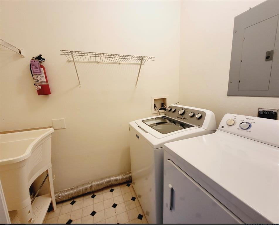 8843 Villa View Circle, Unit 207 Orlando, FL 32821 - Photo 22 of 36 a utility room with dryer and washer