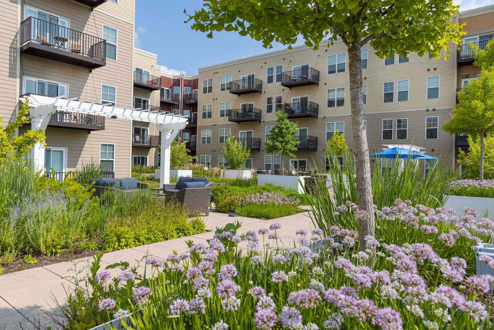 255 North Addison Avenue, Unit 439 Elmhurst, IL 60126 - Photo 16 of 23 a front view of multi story residential apartment building with yard and green space