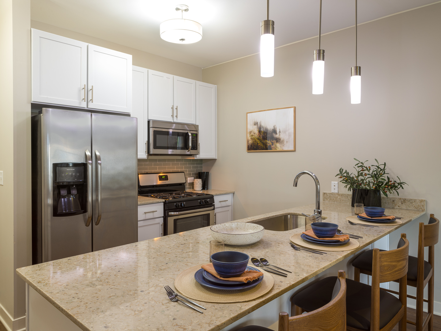 255 North Addison Avenue, Unit 439 Elmhurst, IL 60126 - Photo 4 of 23 a kitchen with stainless steel appliances granite countertop a sink a stove a refrigerator with a dining table and chairs
