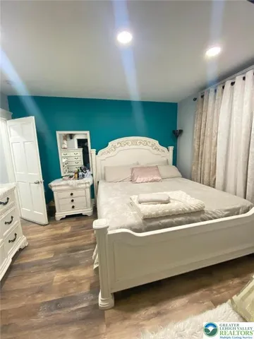 a bedroom with a bed and window