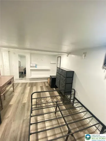 a view of a storage & utility room with sink dryer and washer