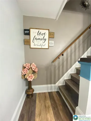 a bed sitting in a room next to a window