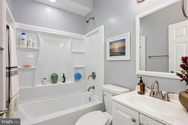 a bathroom with a sink a toilet and a bathtub