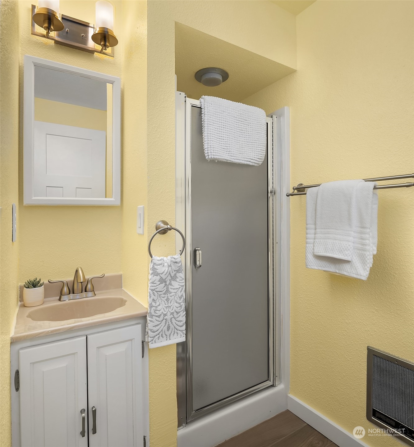 1615 Eagle Ridge Drive South, Unit 4 Renton, WA 98055 - Photo 16 of 29 a bathroom with a sink a mirror and a shower