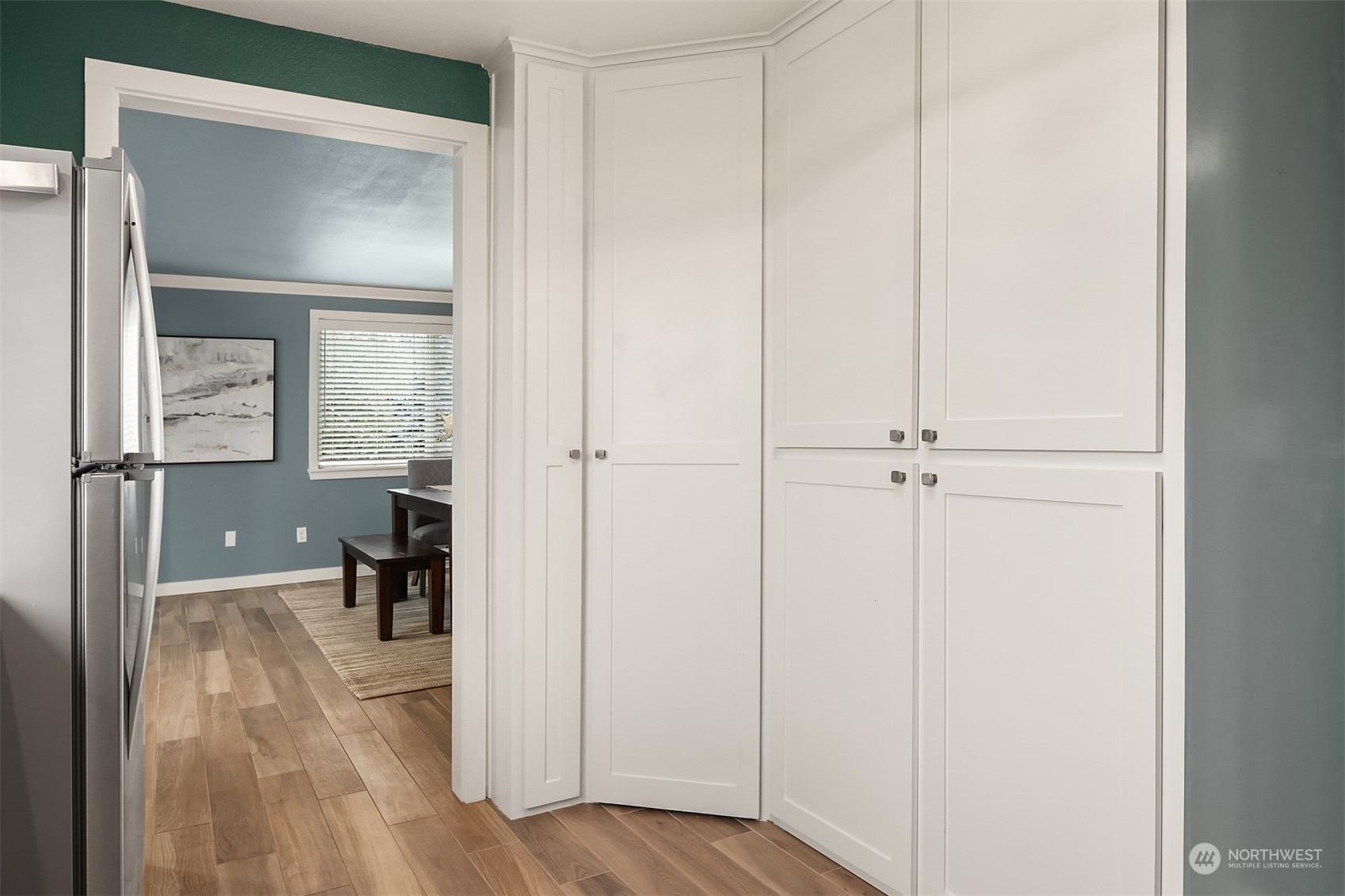 1615 Eagle Ridge Drive South, Unit 4 Renton, WA 98055 - Photo 6 of 29 a view of a hallway with wooden floor windows and a bathroom
