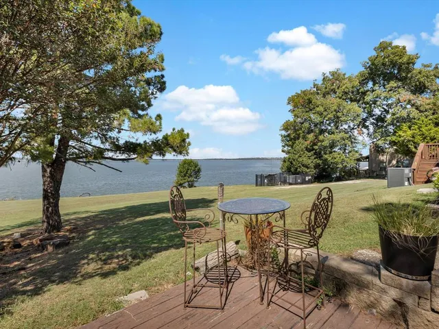 a view of a chairs and table on the garden