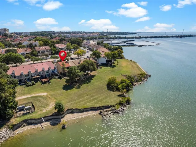 a balcony with wooden floor and fence