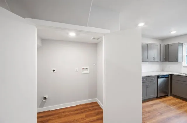 a view of a kitchen from the hallway