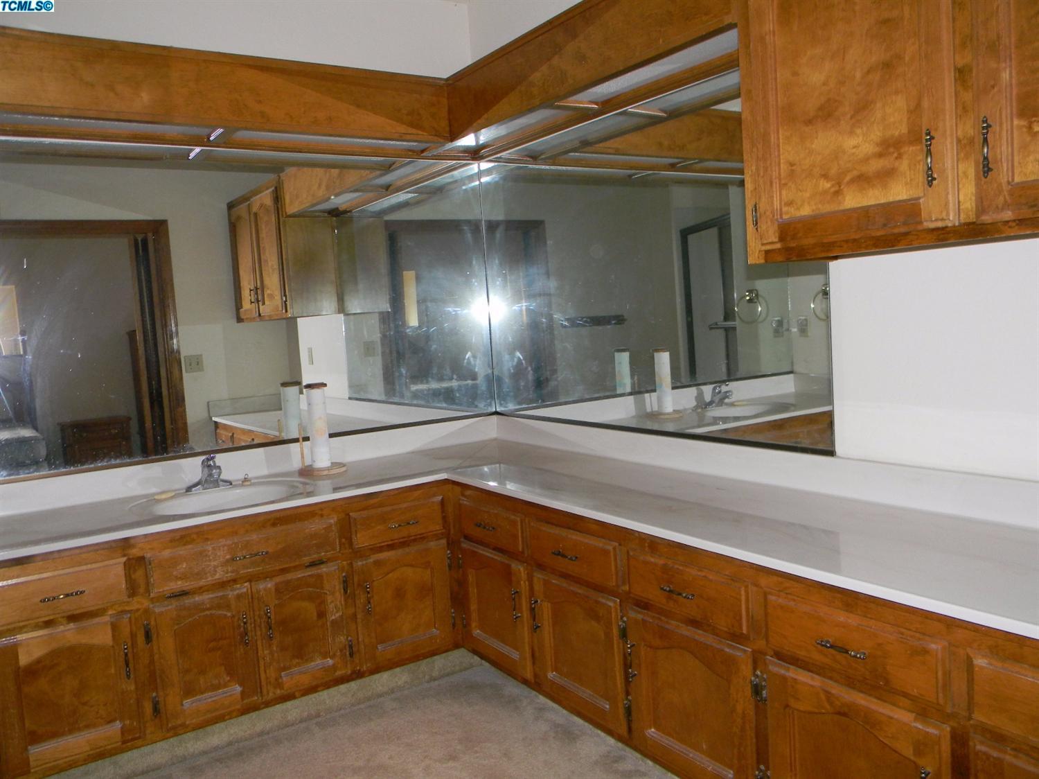 40675 Crystal Drive Three Rivers, CA 93271 - Photo 31 of 34 a bathroom with a sink and a mirror