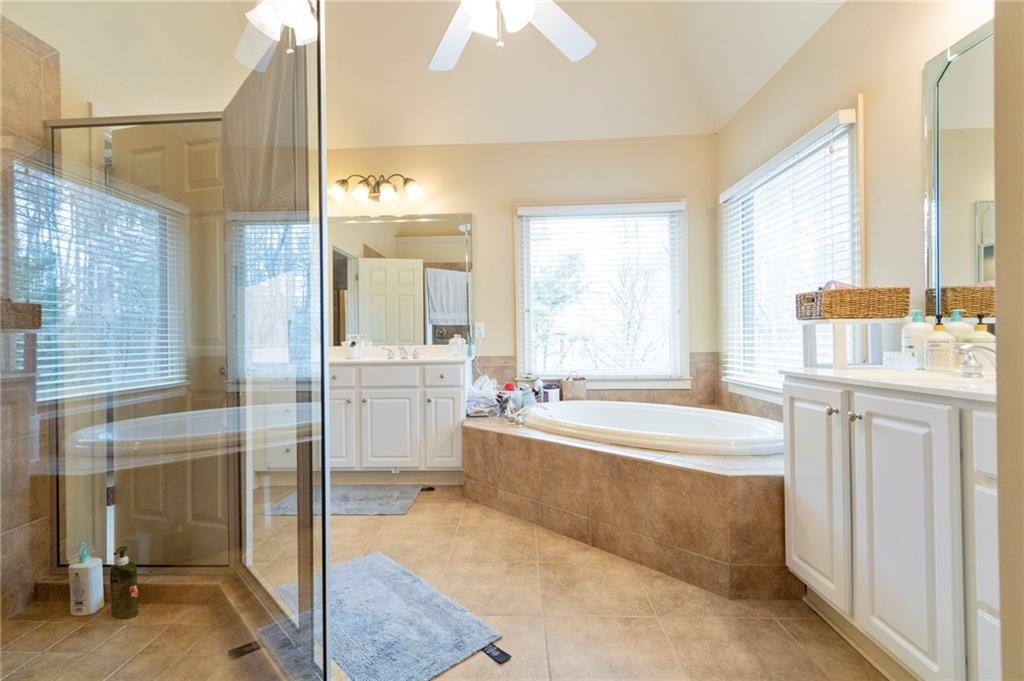 202 Davis Mill Road Ball Ground, GA 30107 - Photo 13 of 21 a spacious bathroom with sink shower and bathtub