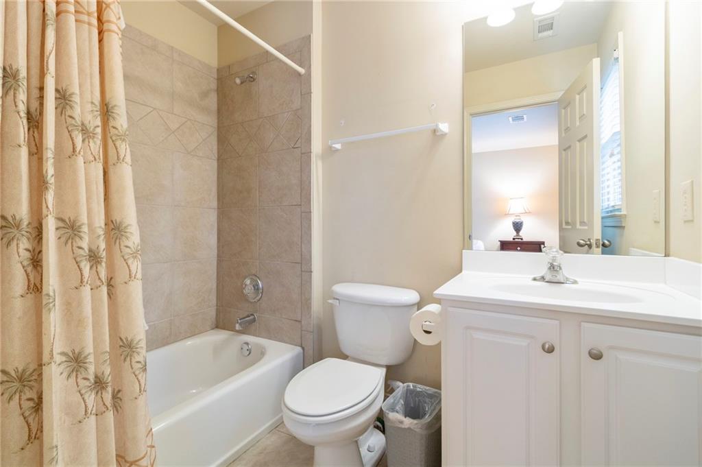 202 Davis Mill Road Ball Ground, GA 30107 - Photo 14 of 21 a bathroom with a sink toilet vanity granite shower and bathtub