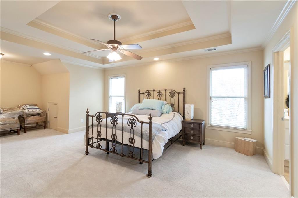 202 Davis Mill Road Ball Ground, GA 30107 - Photo 15 of 21 a bed room with a bed and a chair