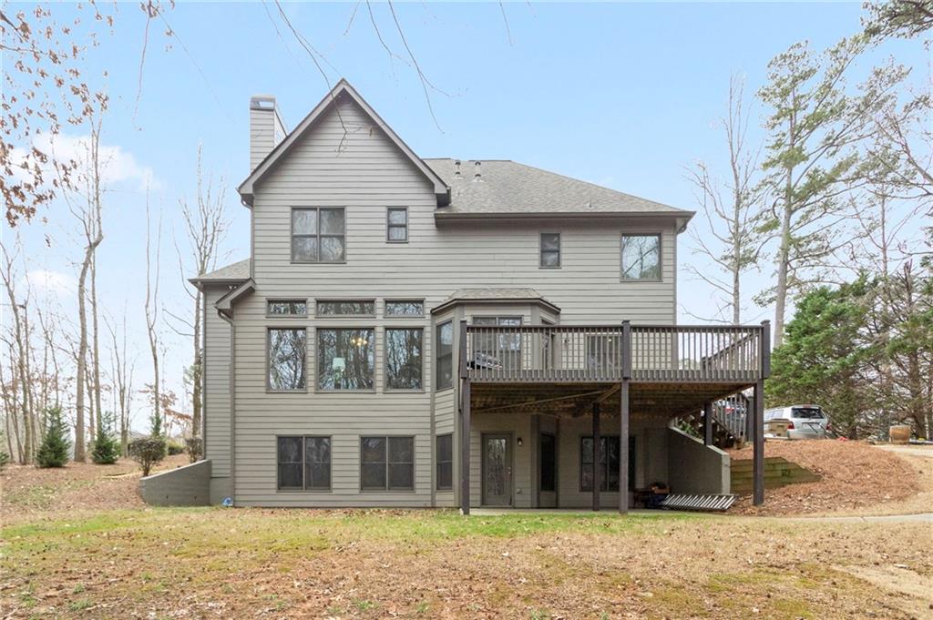 202 Davis Mill Road Ball Ground, GA 30107 - Photo 19 of 21 a front view of a house with a yard