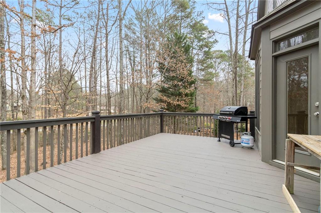202 Davis Mill Road Ball Ground, GA 30107 - Photo 20 of 21 a balcony with wooden floor and fence